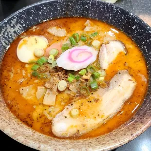 Black garlic ramen. With added chicken wontons.  Spice level at 2. Pretty good and flavorful with plenty of bamboo shoots.