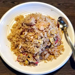 a bowl of rice and a spoon