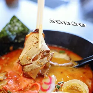 a bowl of ramen and chopsticks