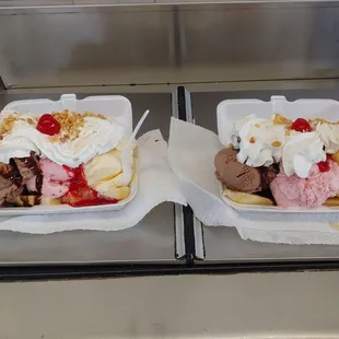 two ice cream sundaes with toppings
