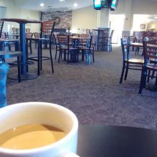 Corner comfy chair gazing across the sea to the fireplace.