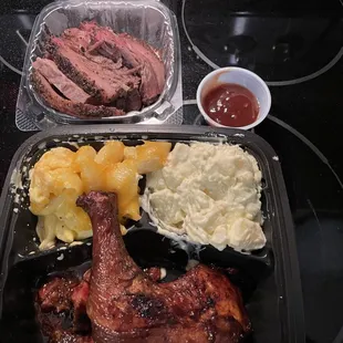 Brisket, burnt  ends, chicken quarter, mac and cheese and potato salad.