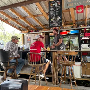 two men sitting at a bar
