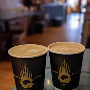 two cups of coffee on a table