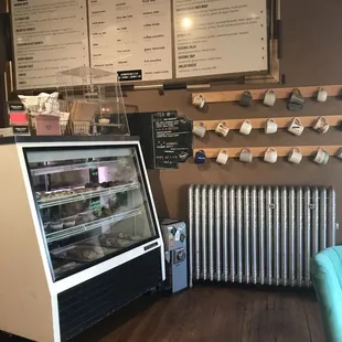 Gypsy Javas menu, in-house pastry cabinet, mug racks for regular patrons