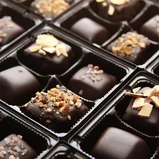a close up of a box of chocolates