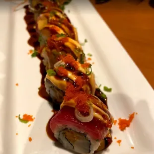 a sushi roll on a white plate