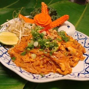a plate of noodles and vegetables