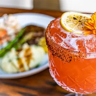 a close up of a drink with a flower on top