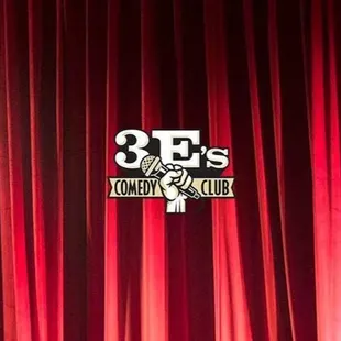 a hand holding a microphone