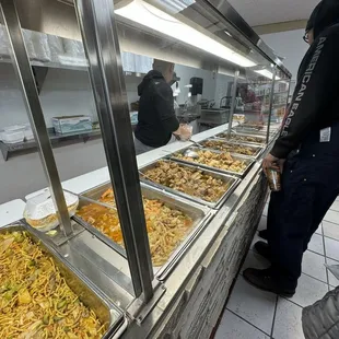 a group of people looking at food