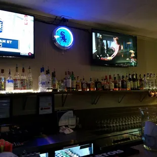 a bar with a lot of bottles of alcohol