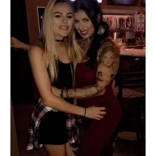 two girls hugging each other