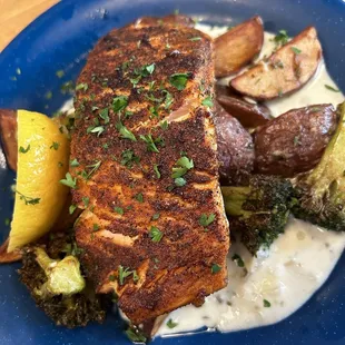 Grilled Salmon with potatoes and yummy sauce and broccoli florets  I definitely squeezed the lemon over things yum