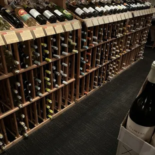 rows of wine bottles on display