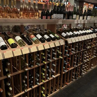 rows of wine bottles on shelves