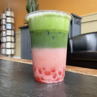 a green and pink drink