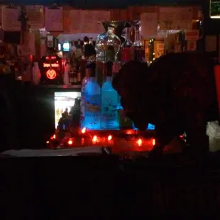 a blue fire hydrant in the middle of a bar