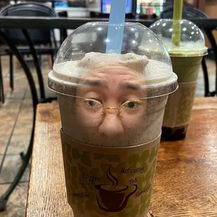 a plastic cup with a face on it
