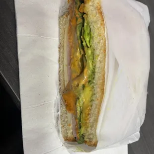 Ham and Swiss cheese sandwich and added chipotle sauce and avocado