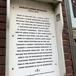 a plaque on the outside of the building