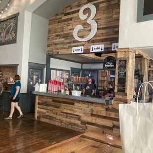 a woman walking past the counter