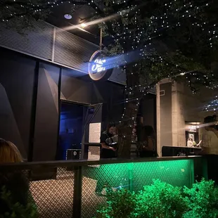 a bar with green lights