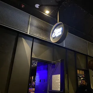 the entrance to a bar