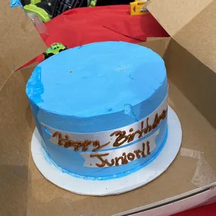 Happy birthday is sloppy ! Cake has dents. Rushed and sloppy job