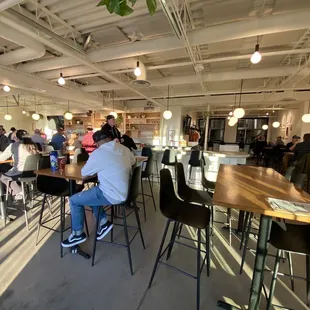 a group of people sitting at tables