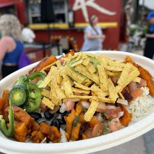 Vegan bowl of cilantro lime rice, seasoned sweet potatoes, black beans and pico