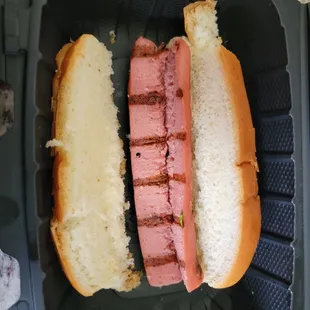two hot dogs in a bun
