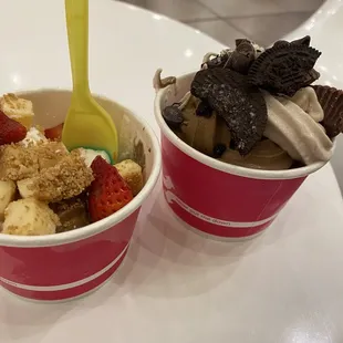 two bowls of ice cream and strawberries