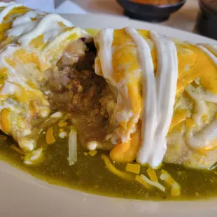 All that wonderful meat inside my wet chile verde burrito. Yum