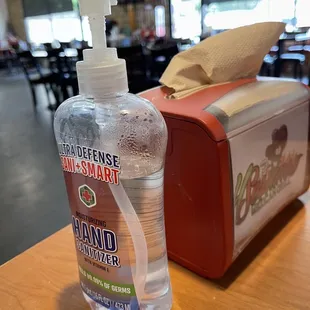 Each table has hand sanitizer