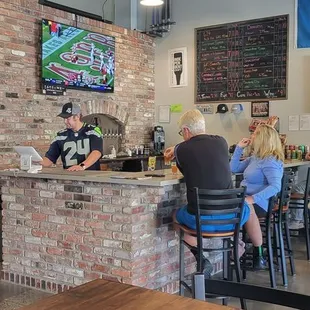 customers sitting at the bar