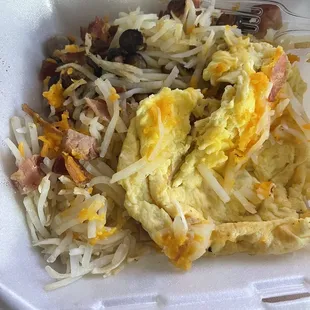 a breakfast in a styrofoam container