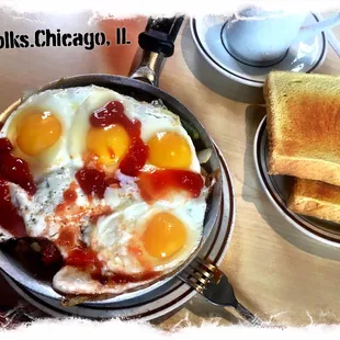 a pan of eggs and toast