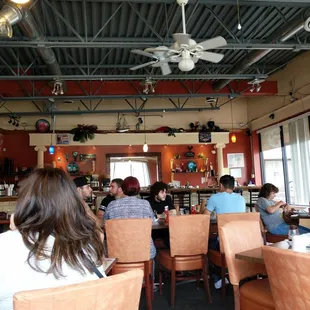 a group of people sitting in a restaurant