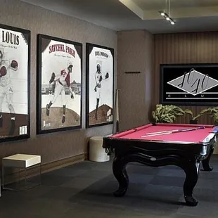 a pool table in the middle of the room
