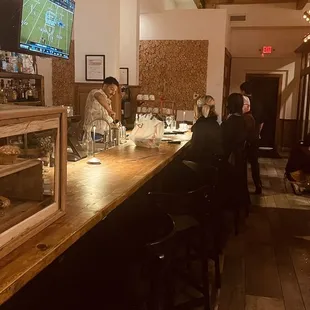 people sitting at a bar