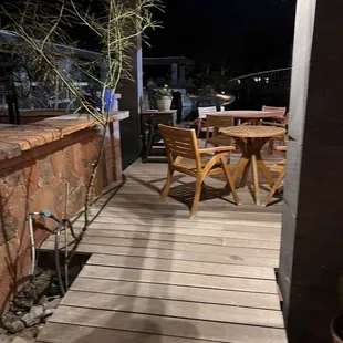 Deck for outdoor seating overlooks a big pond- beautiful and serene.