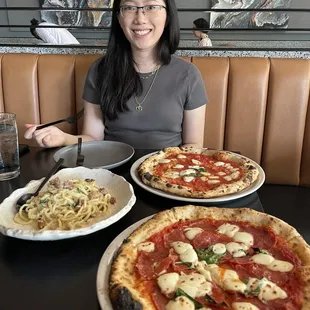 Bucatini alla Carbonara, Margherita Verace Pizza, and Diavola Pizza with basil instead of arugala.