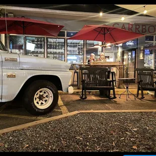 a truck parked in front of a restaurant