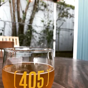 a glass of beer on a table