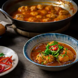 a bowl of stew and a plate of bread