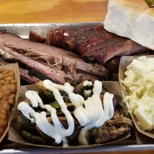 Three meat platter. The fried Brussels Sprouts, drizzle of homemade aioli sauce, is an additional premium side, but so worth it.