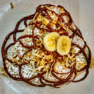 Paradise Crepe with roasted coconut, banana and Nutella