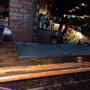 a bar with a wooden bar top