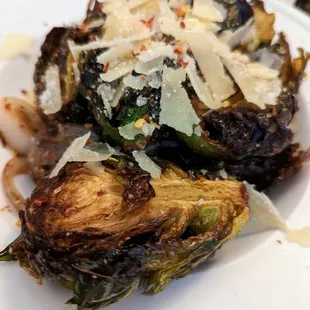 Brussels Sprouts. $10. Deep fried, grated Parmesan, chili flake, shallots.